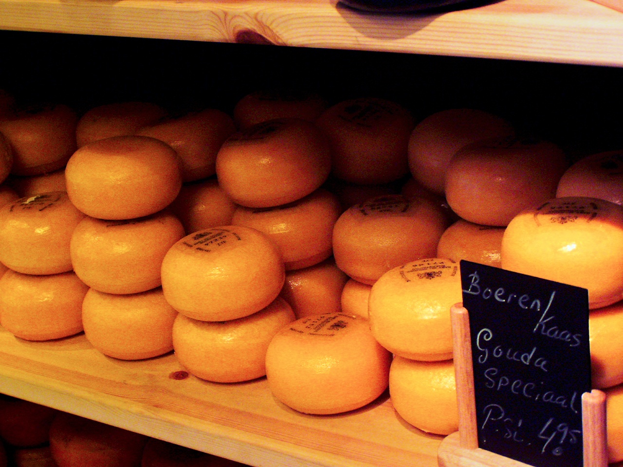 Wheels of farmhouse Gouda in an Amsterdam cheese shop