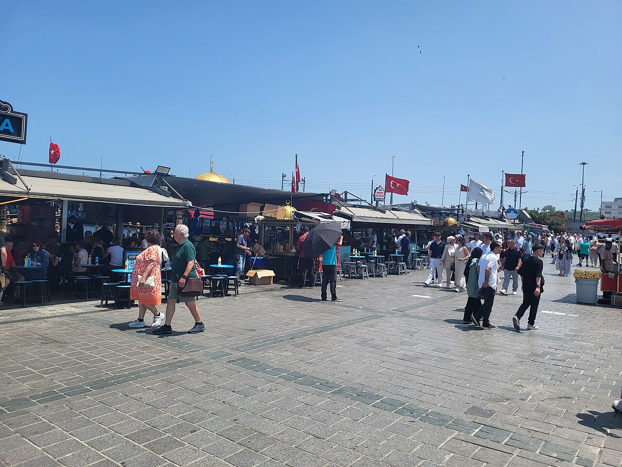 The balık ekmek counters and their stools on the Eminönü quay