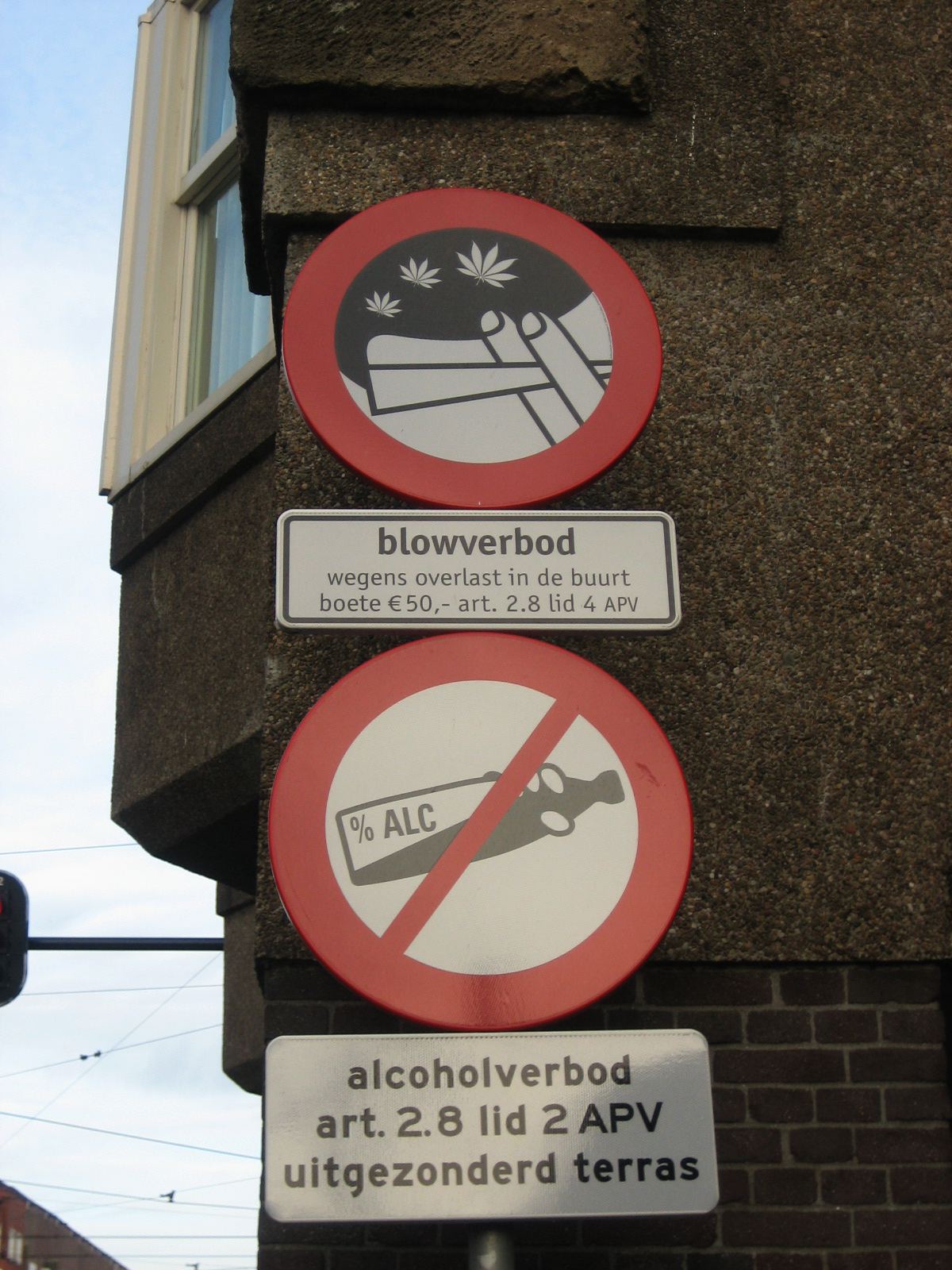 Signs banning cannabis smoking and alcohol drinking in an Amsterdam street