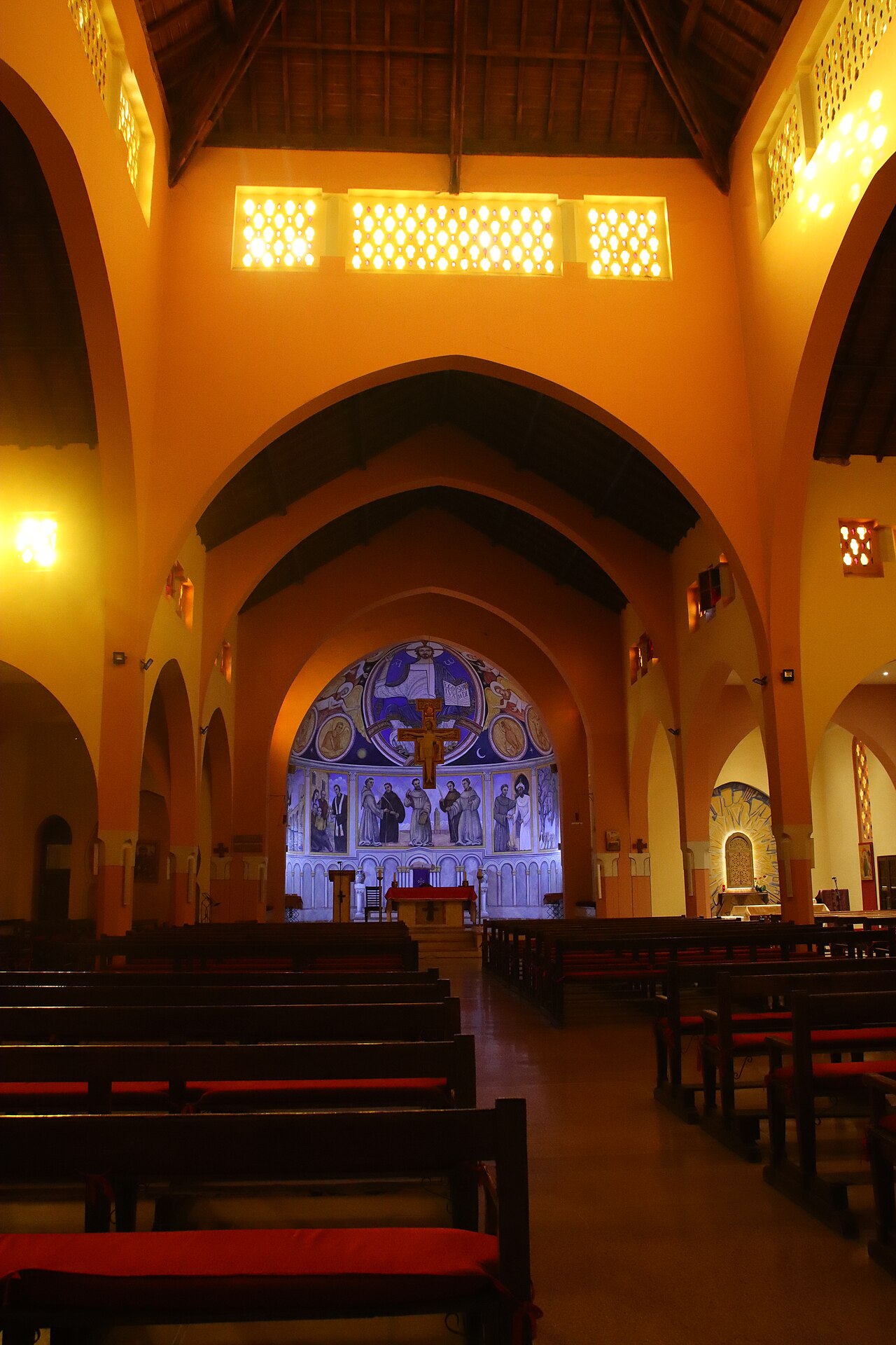 Nave of the Church of the Holy Martyrs, with its arches and painted apse