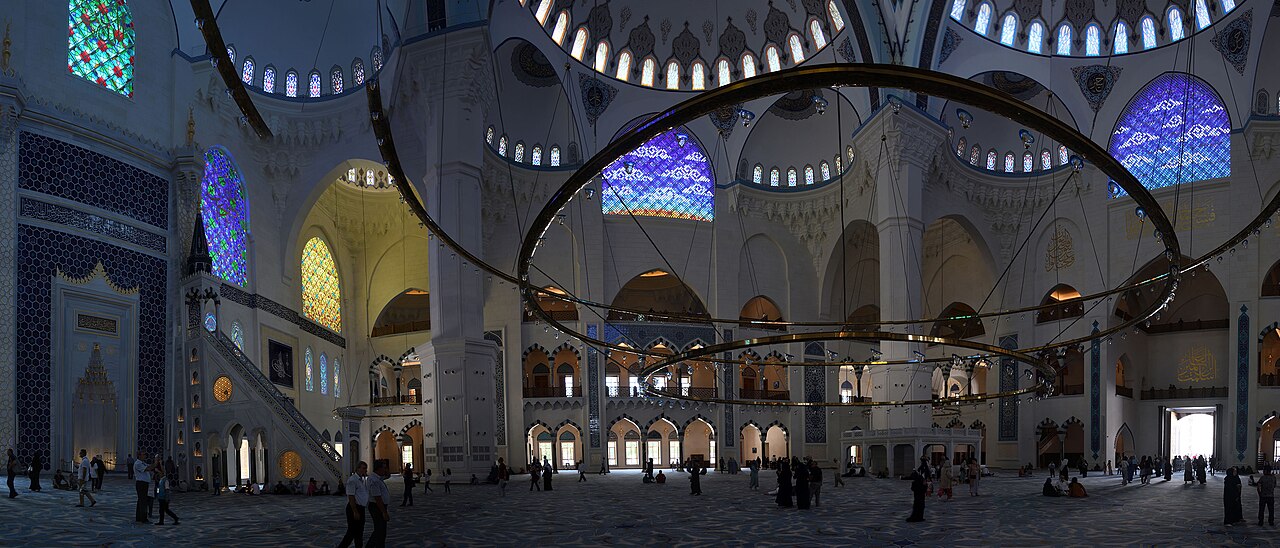 Inside the Grand Çamlıca Mosque, with its stained glass and large circular chandelier