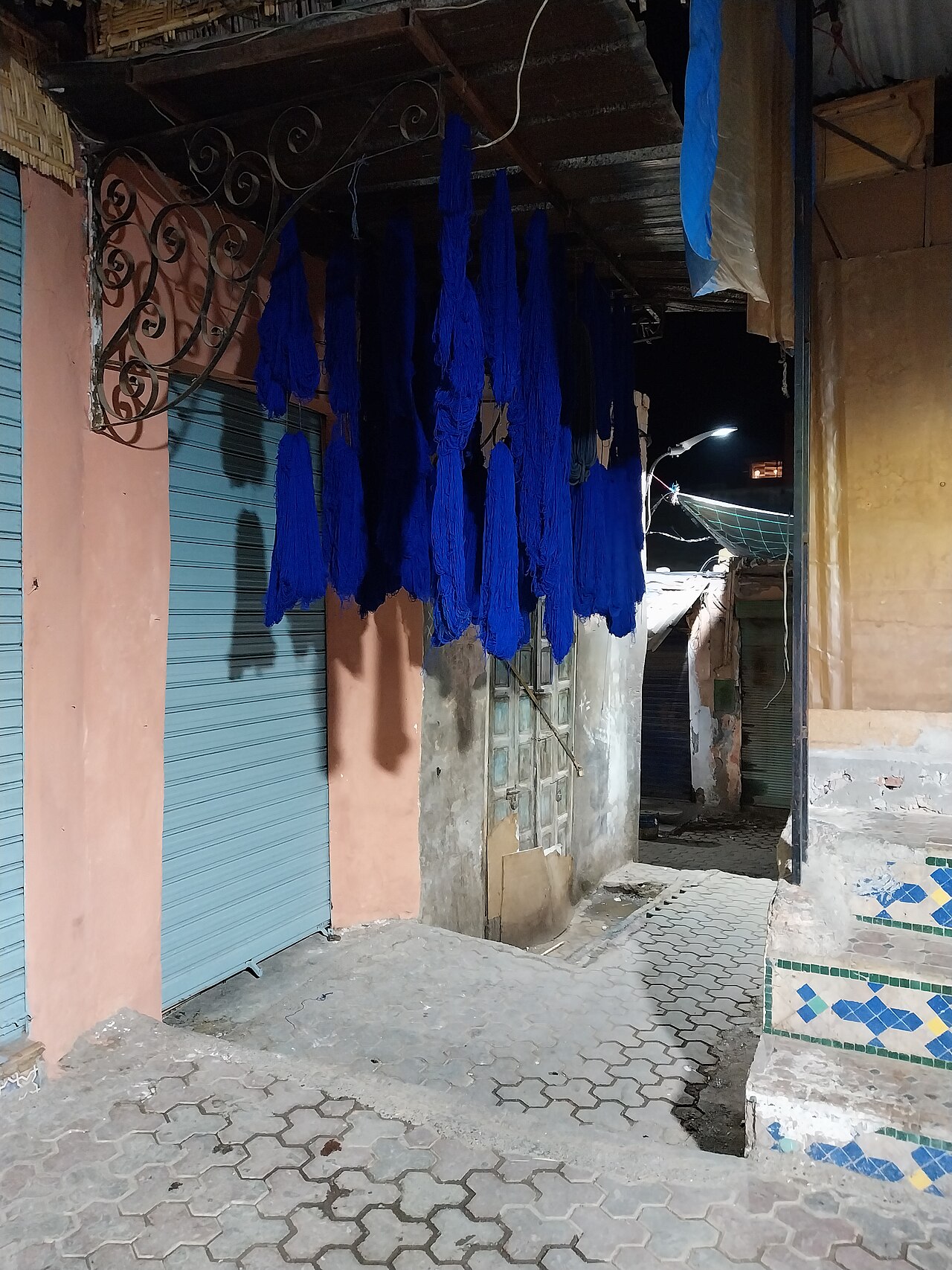 Skeins of blue wool drying in the dyers' alley