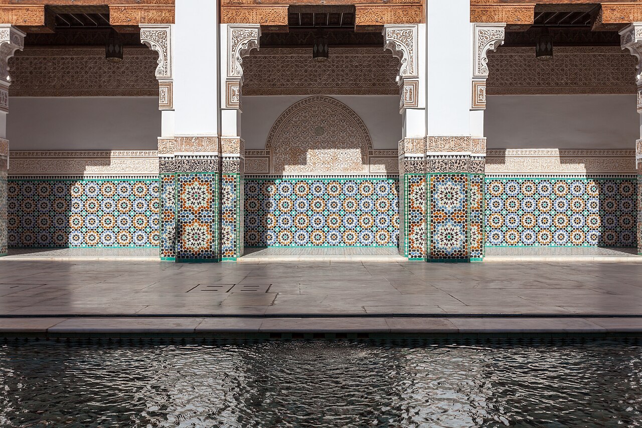 Arcades and zellige tiles around the pool of the Ben Youssef Medersa