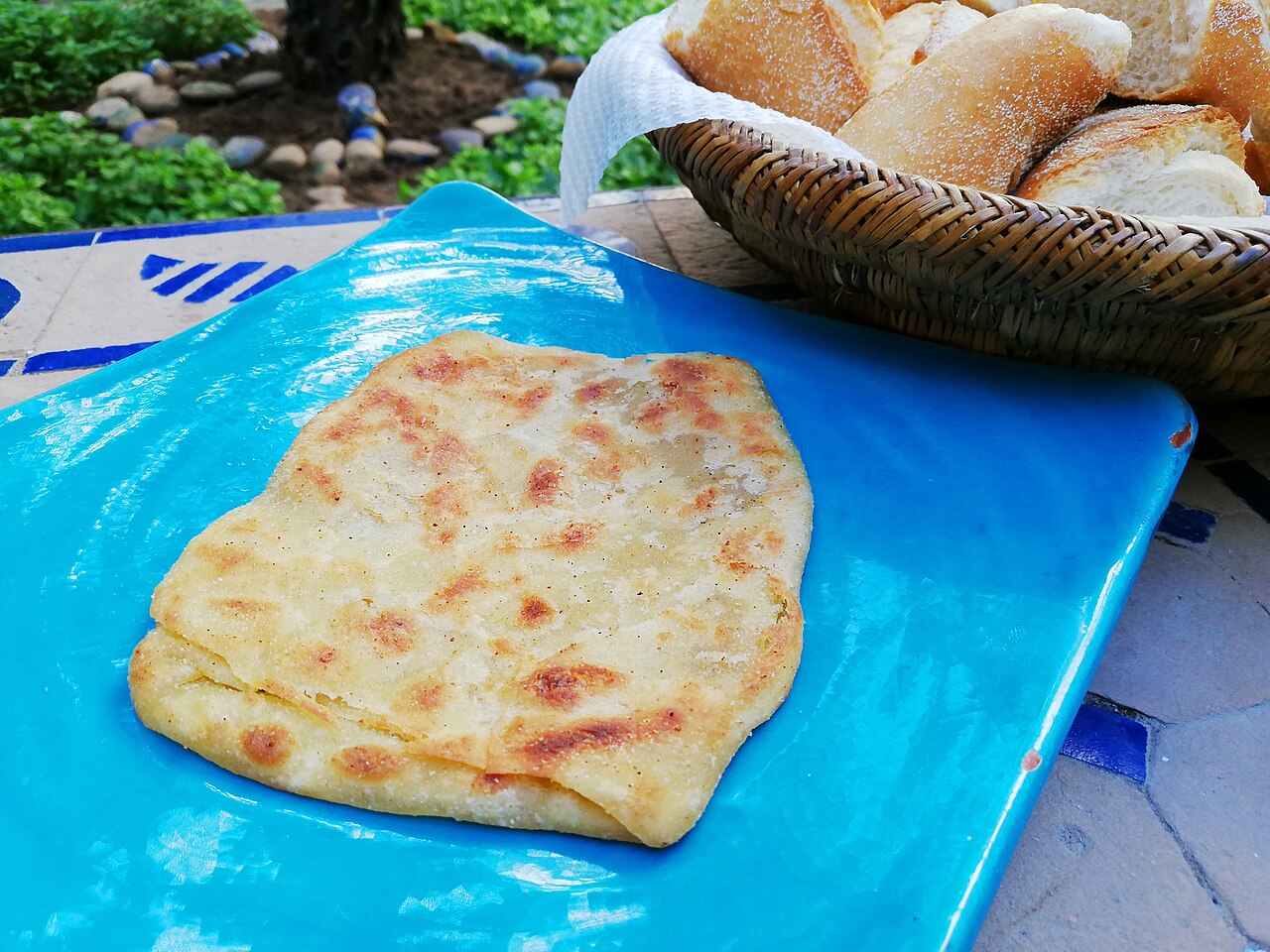 Msemen, a flaky Moroccan flatbread, served with bread
