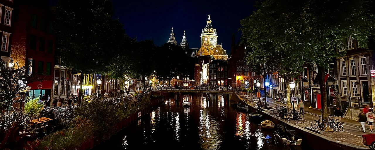 The Oudezijds Achterburgwal canal at night, in the heart of the Red Light District