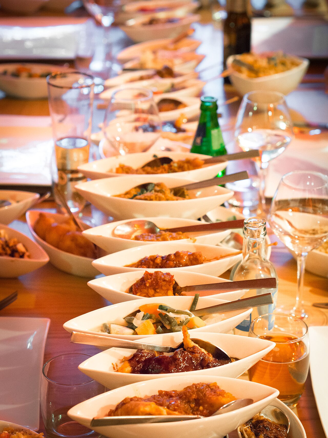 A rijsttafel served as a long row of small dishes