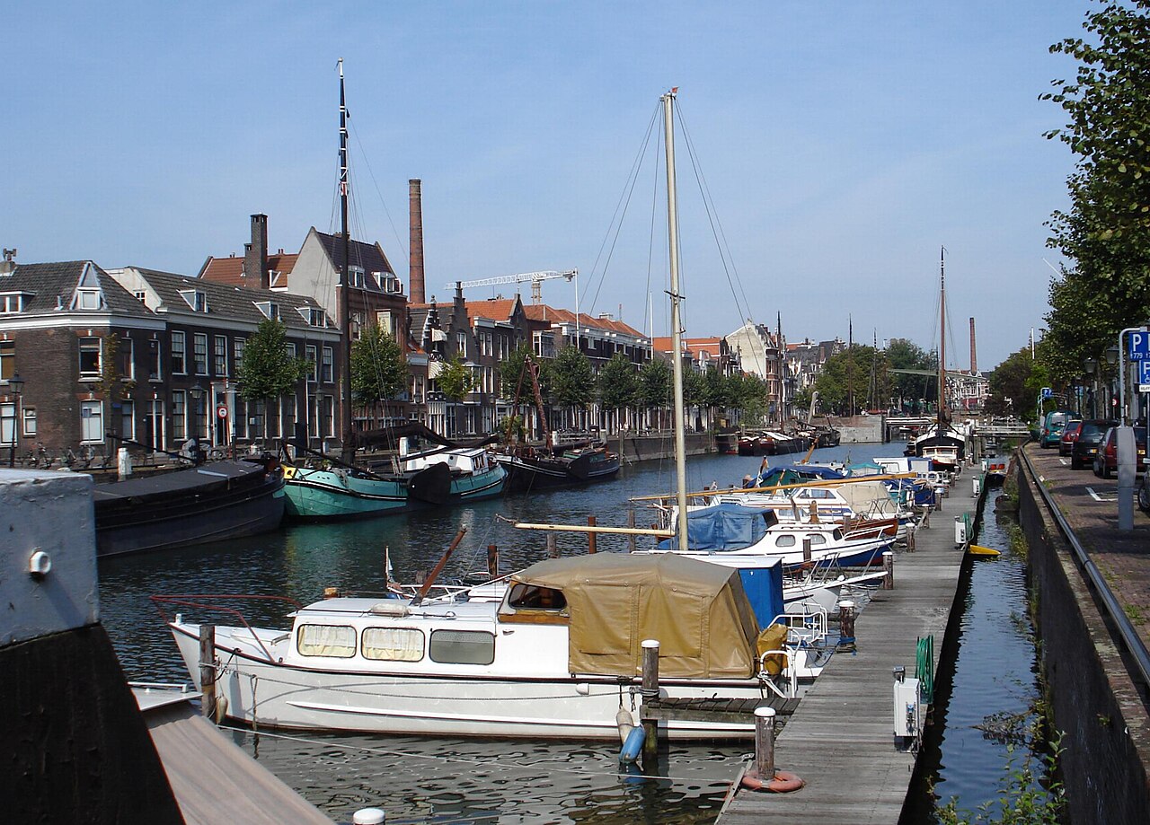 The Voorhaven in Delfshaven, lined with old houses and boats