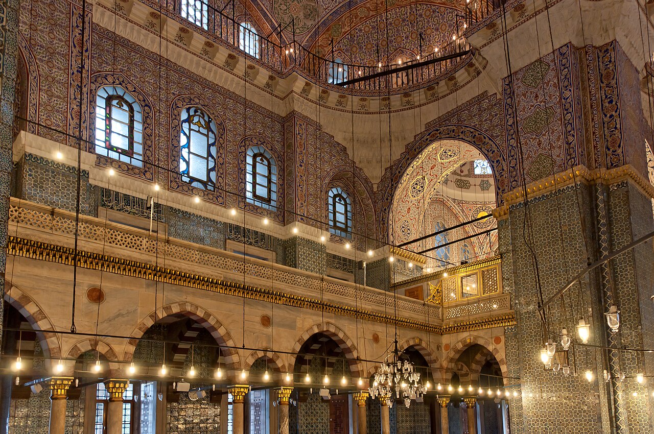 The prayer hall of the New Mosque in Eminönü, with its tiles and gilded gallery